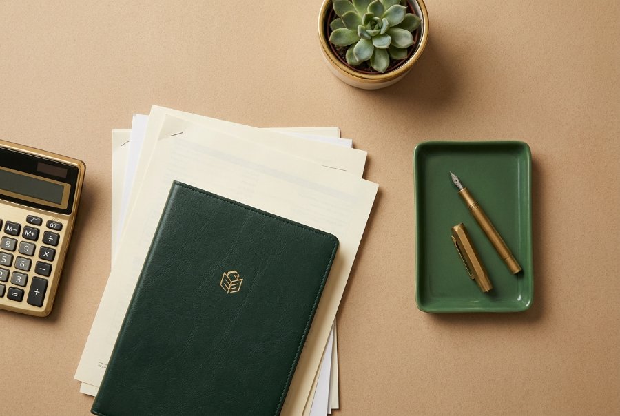 Calculator, documents and pen — refinance break-even worksheet